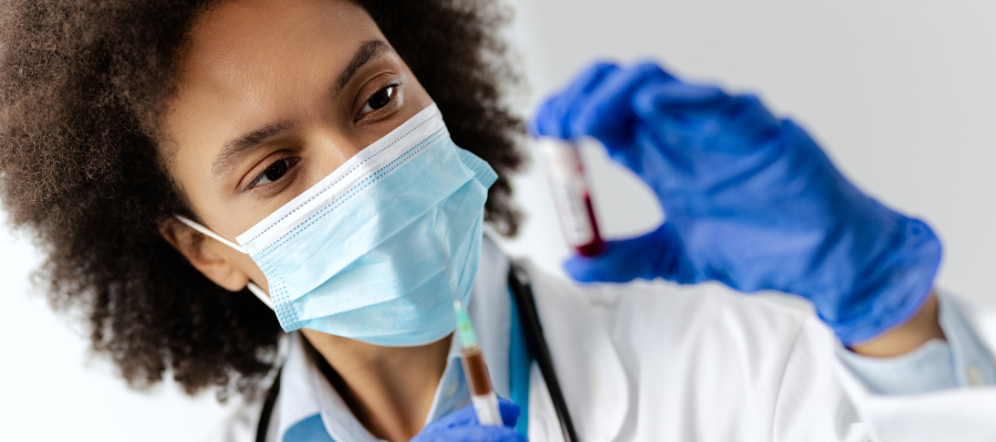 Photo of epidemiologist examining sample